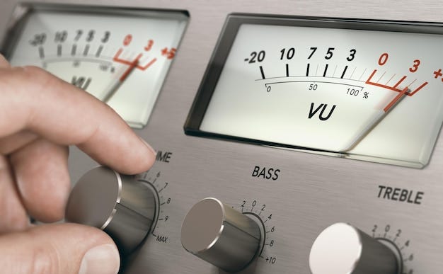 Premium Photo | Man turning volume button of a vintage analogic amplifier to increase sound volume. Composite image between a hand photography and a 3D background. Premium Photo | Man turning volume button of a vintage analogic amplifier to increase sound volume. Composite image between a hand photography and a 3D background.
