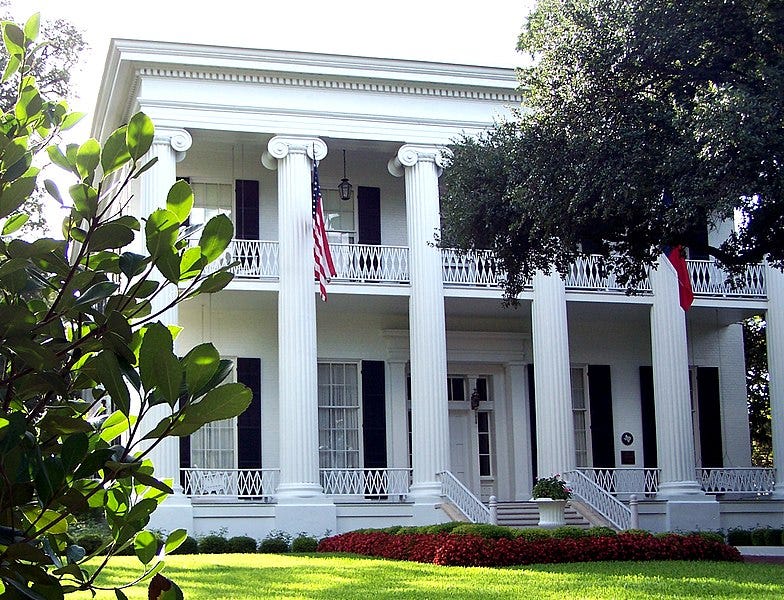 A white house with columns with Texas Governor's Mansion in the background

Description automatically generated