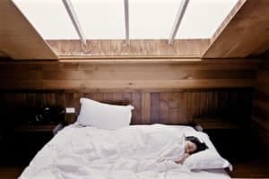 woman asleep in cozy bed