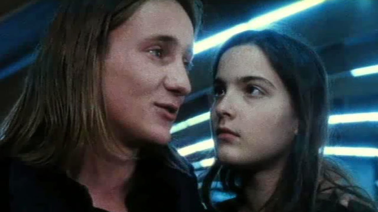A young white man with long blonde hair and a young white woman with long, brunette hair A young white man with long blonde hair and a young white woman with long, brunette hair