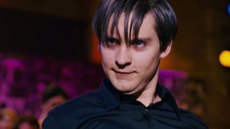 https://www.slashfilm.com/img/gallery/you-can-kinda-thank-heath-ledger-for-tobey-maguires-infamous-spider-man-3-dance-moves/intro-1667386922.jpg
