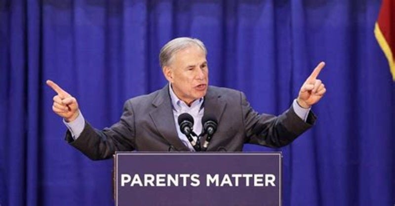 Texas Gov Abbott behind a podium with his index fingers in the air. Texas Gov Abbott behind a podium with his index fingers in the air.