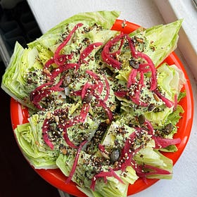 baby wedge salad with coconut green goddess, pickled onions and salad seeds