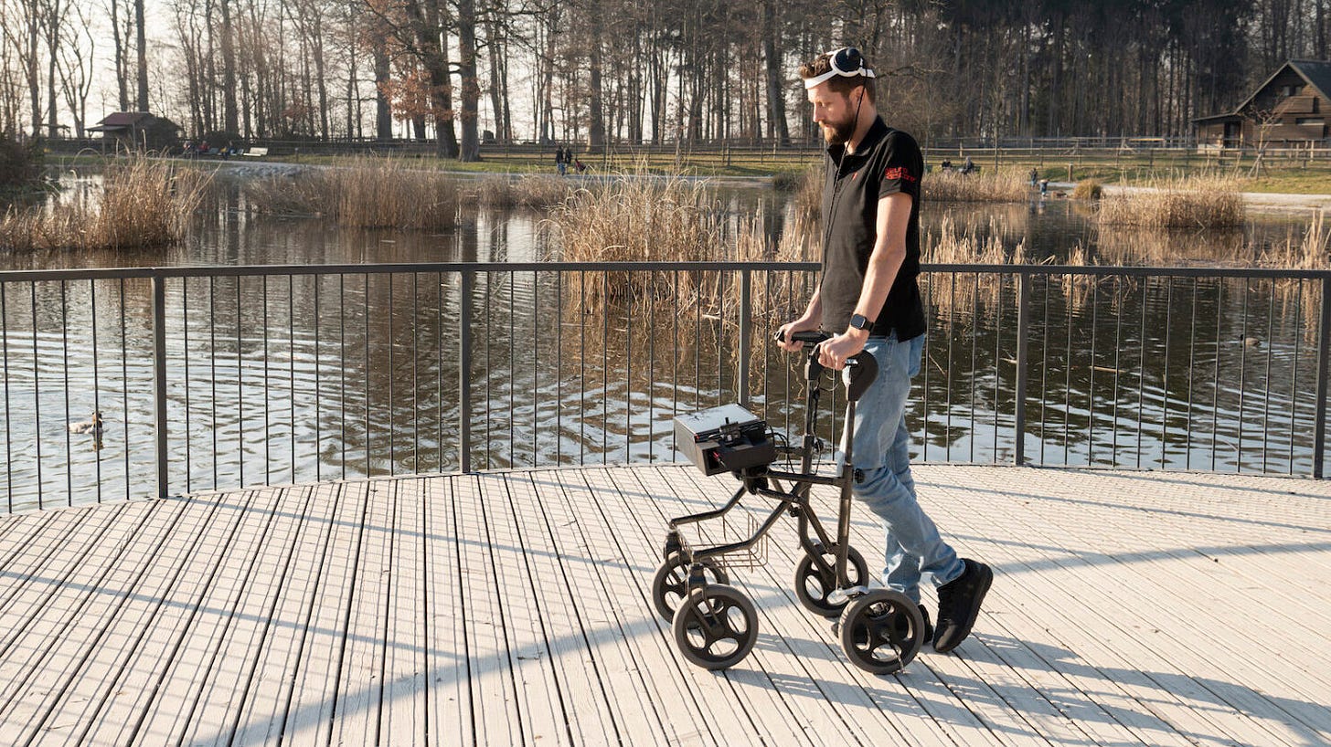 Brain and spine implants enable man with paralysis to walk again