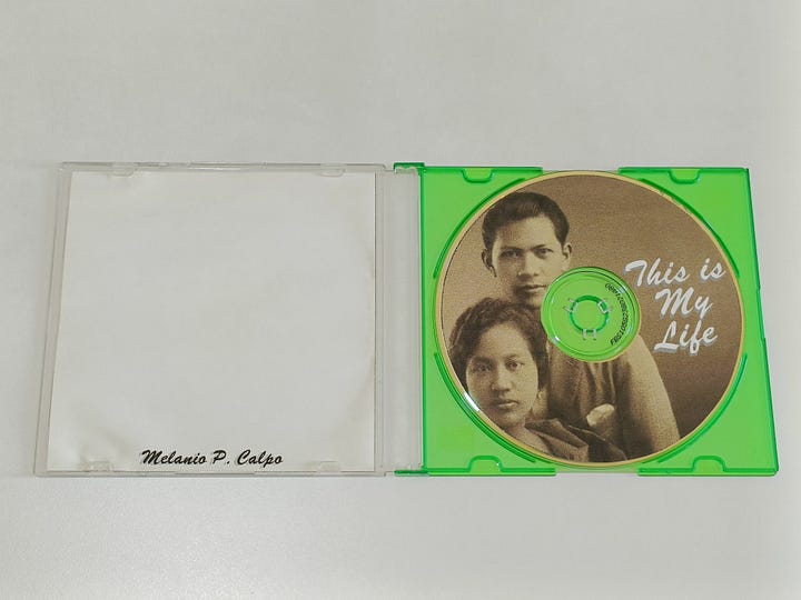 Photos of an autobiography in CD-ROM and a CD-ROM drive