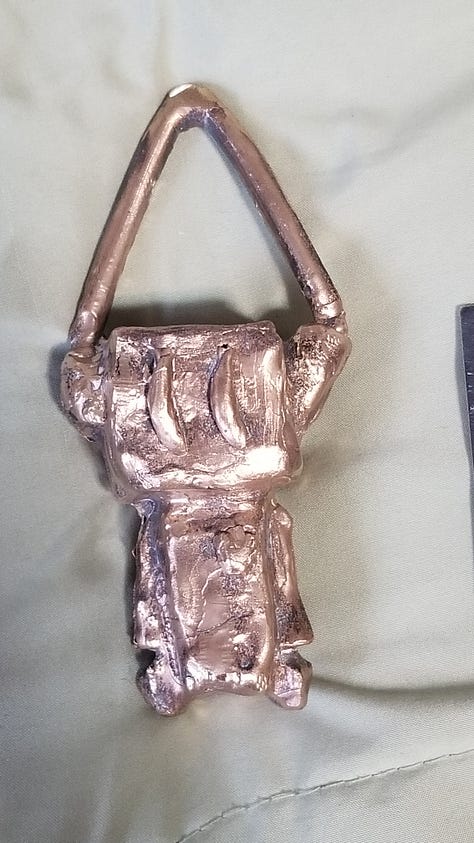 a cartoon robot drawn and painted on many surfaces.