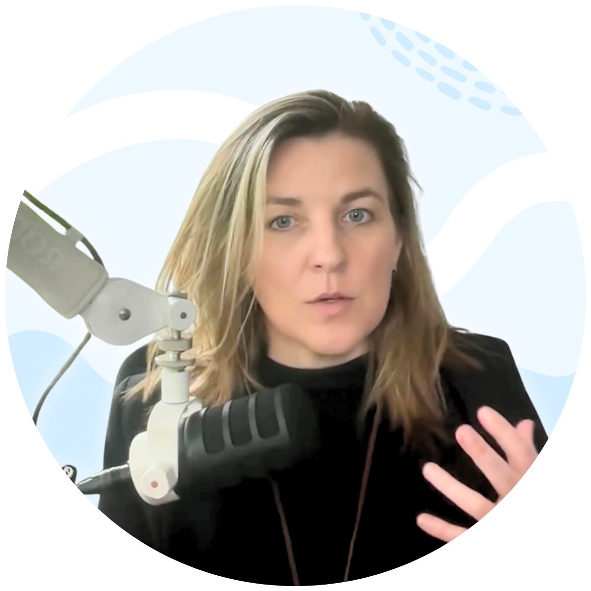 Image of Dr. Neff speaking at a microphone with a light blue background. Image of Dr. Neff speaking at a microphone with a light blue background.