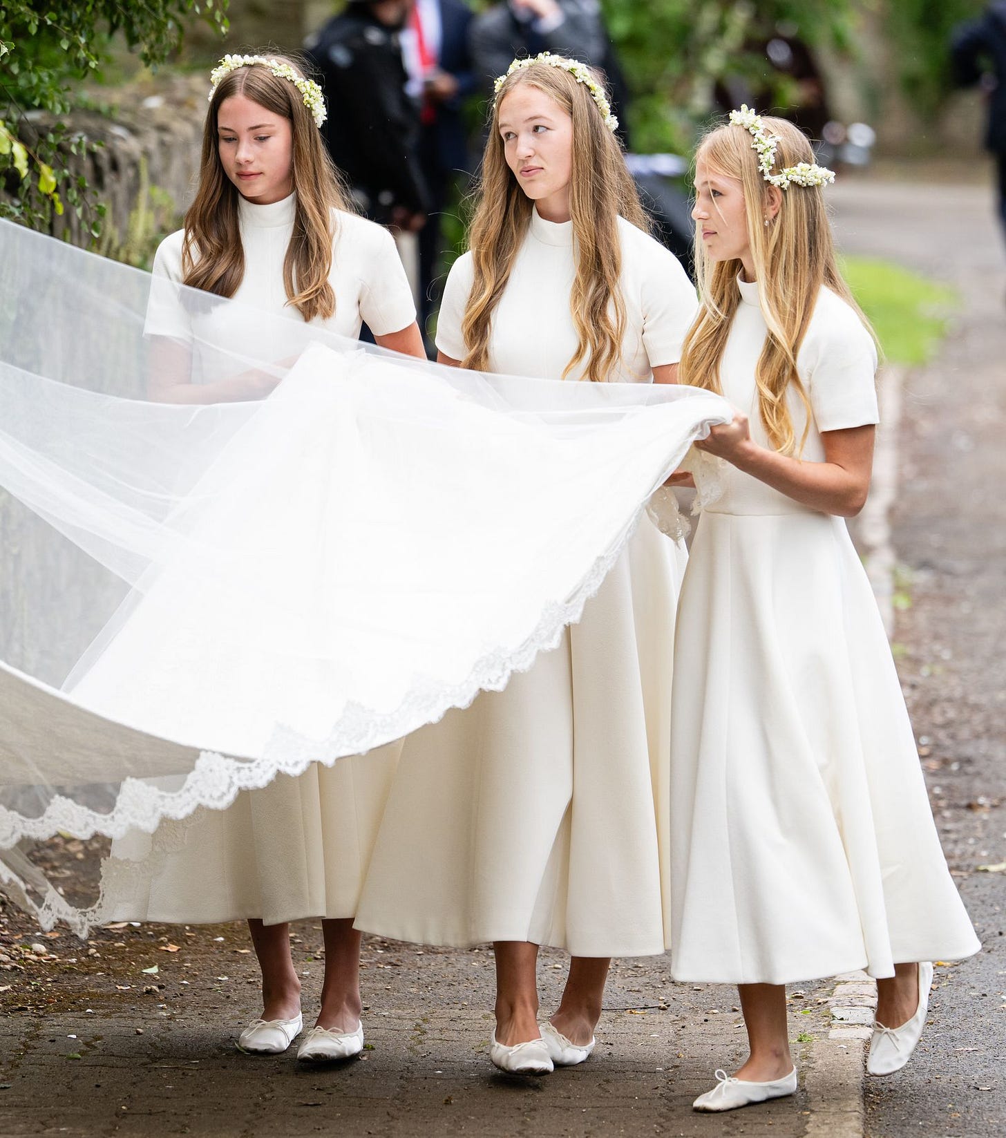 Image may contain Helen Svedin Clothing Dress Fashion Formal Wear Gown Wedding Wedding Gown Adult and Bridesmaid