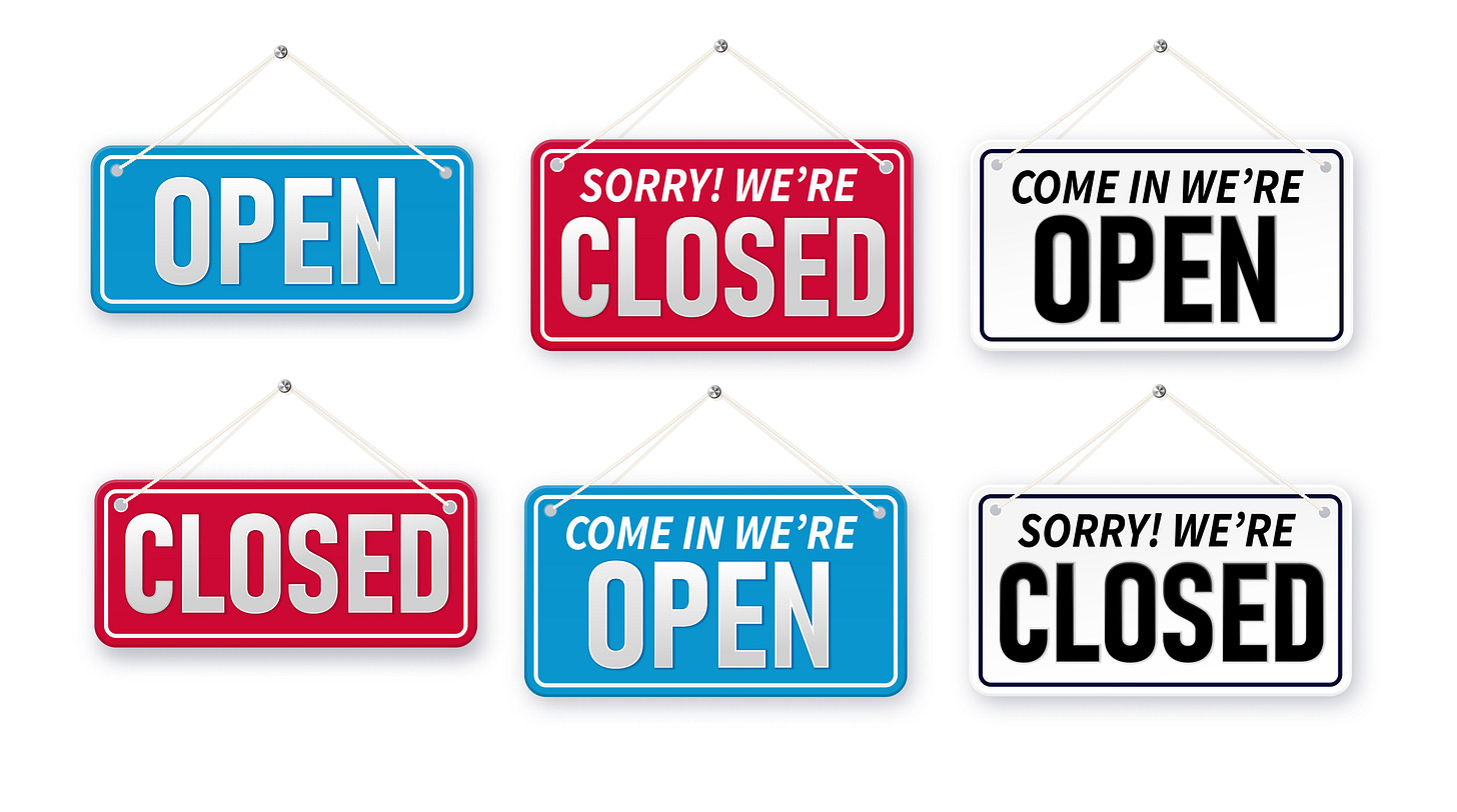 Several signs saying "open" and "closed" Several signs saying "open" and "closed"