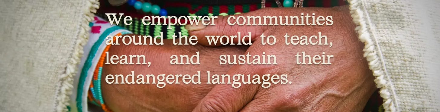Banner image from 7000 Languages' website, depicting an indigenous person wearing traditional clothing with her hands folded in front of her.