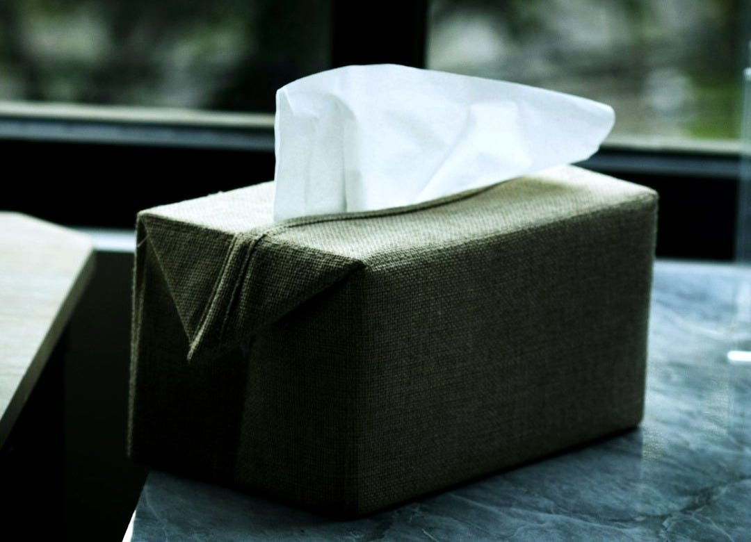 gray box beside glass window