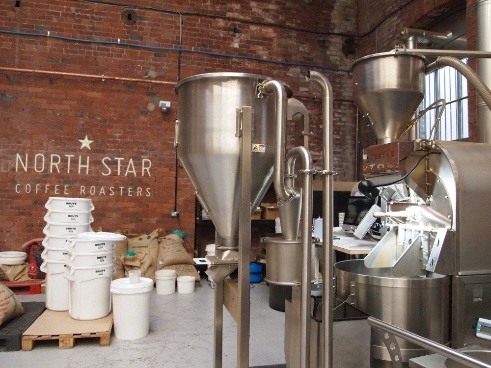 North Star Coffee Roasters, interior brickwork and metal coffee machinery.