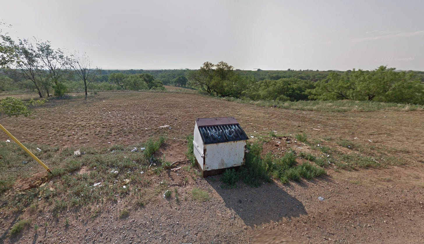 Street View image of dumpster and undeveloped land Street View image of dumpster and undeveloped land