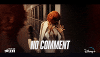 A GIF of a woman walking away from a reporter saying 'no comment'