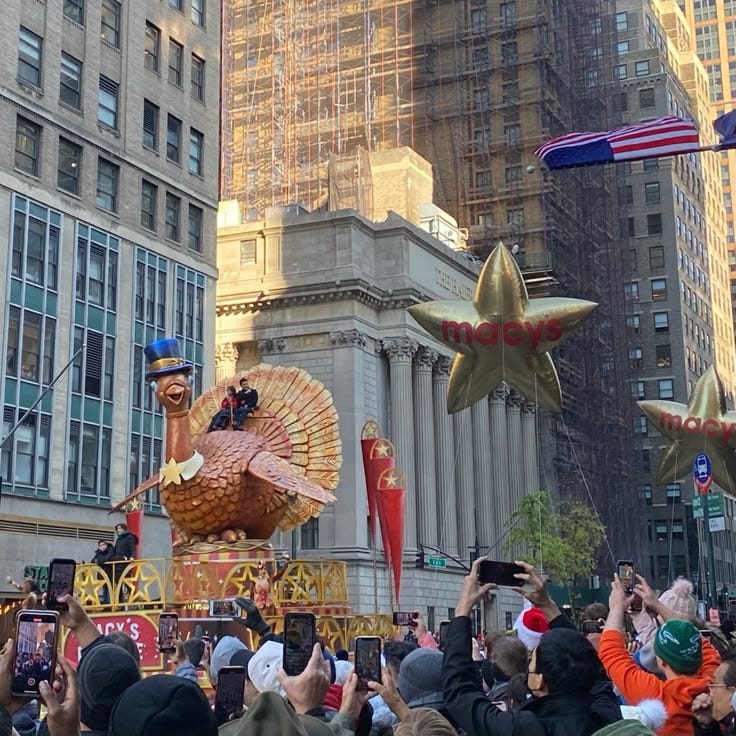 This may contain: people are taking pictures of floats in the street