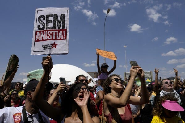 Activists chant "No amnesty" during a protest against an amnesty bill that could absolve former President Jair Bolsonaro and his allies convicted for a 2023 coup attempt, in Brasilia, Brazil, Sunday, Sept. 21, 2025. (AP Photo/Eraldo Peres) Activists chant "No amnesty" during a protest against an amnesty bill that could absolve former President Jair Bolsonaro and his allies convicted for a 2023 coup attempt, in Brasilia, Brazil, Sunday, Sept. 21, 2025. (AP Photo/Eraldo Peres)