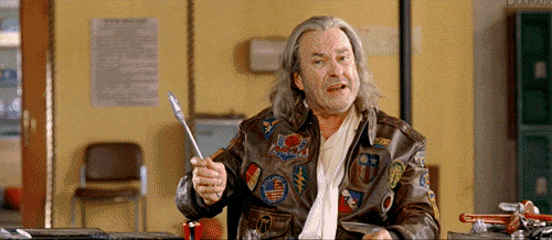 gif from movie dodgeball where patches o'houlihan throws a wrench at student and says 'if you can dodge a wrench, then you can dodge a ball"