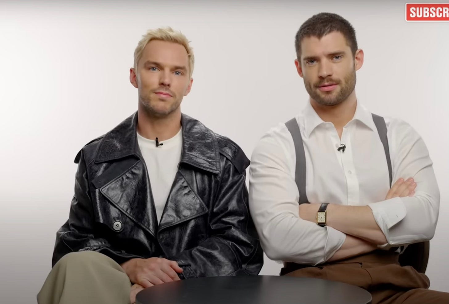 Nicholas Hoult and David Corenswet look at the camera during a snack wars video for LadBible