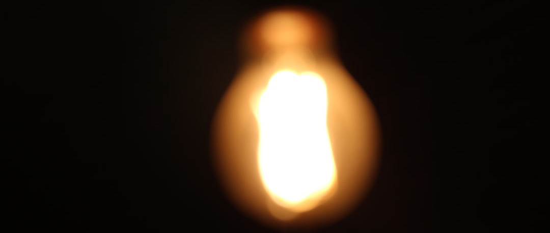 A close up of a light bulb in the dark