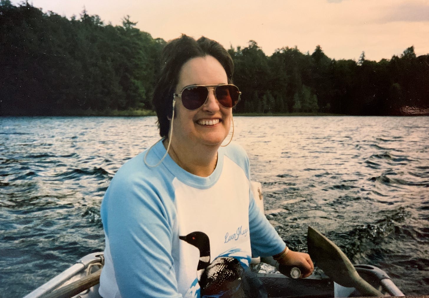 A woman motoring a boat through Maine waters
