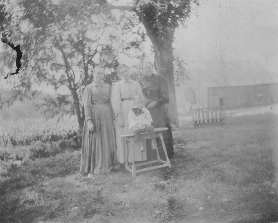 Three women and child at Thayer Farm