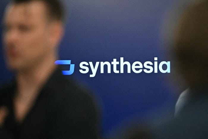 The Synthesia company logo displayed on a blue background.