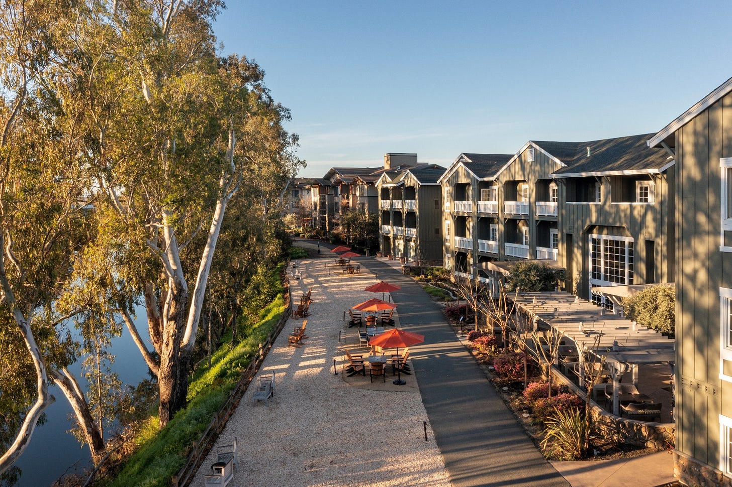 A group of buildings next to a lake

AI-generated content may be incorrect.