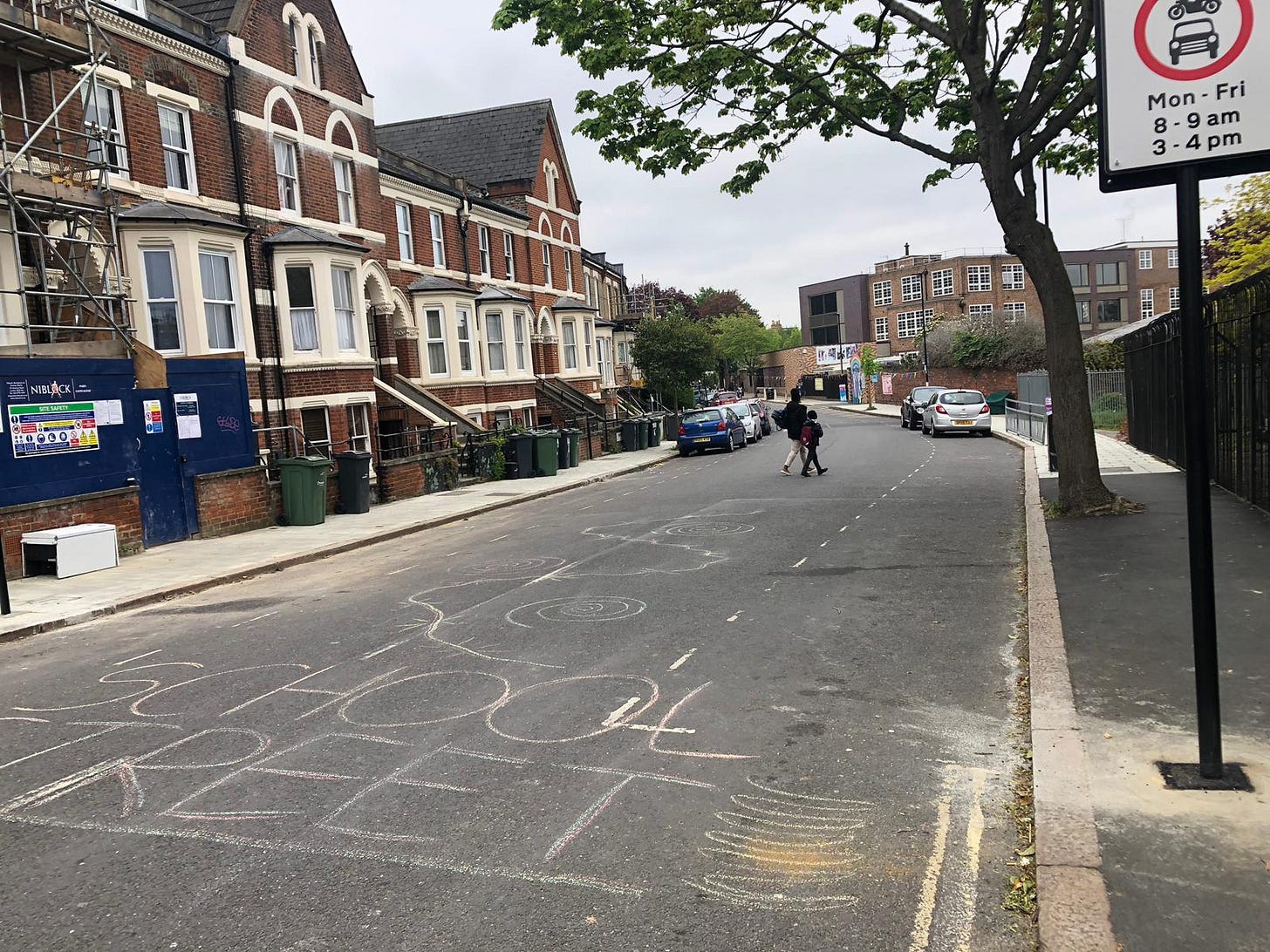 Photo of a quiet street outside a school