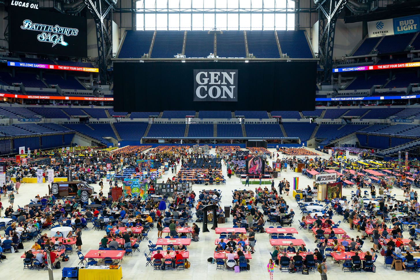 A wide shot of the interior of Lucas Oil Stadium, showing dozens of gaming tables spread across the field.