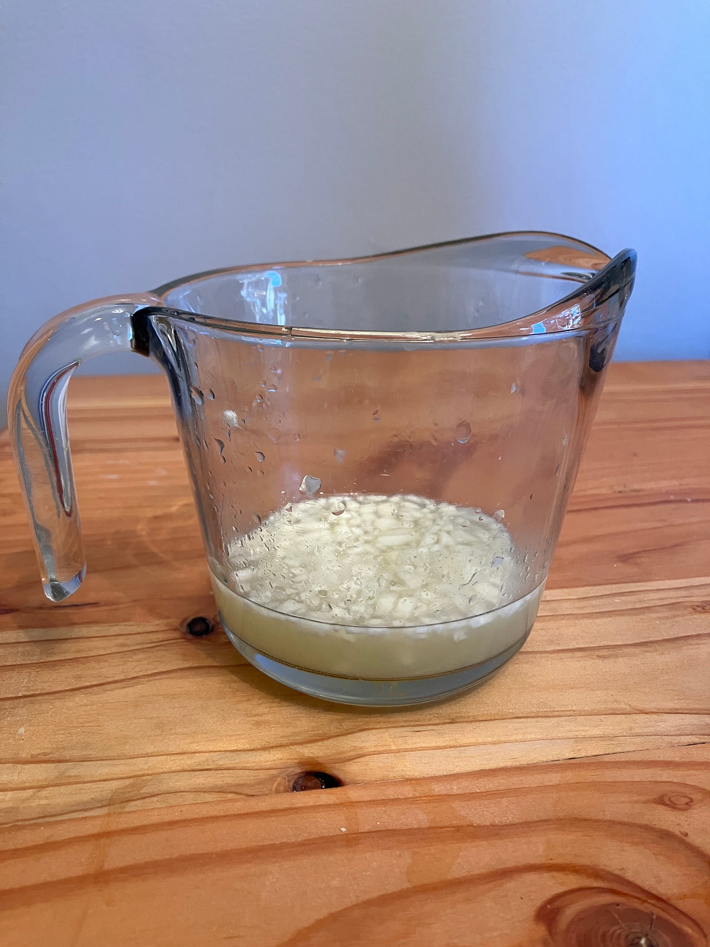 Letting garlic sit in lemon juice - a way to have great hummus.