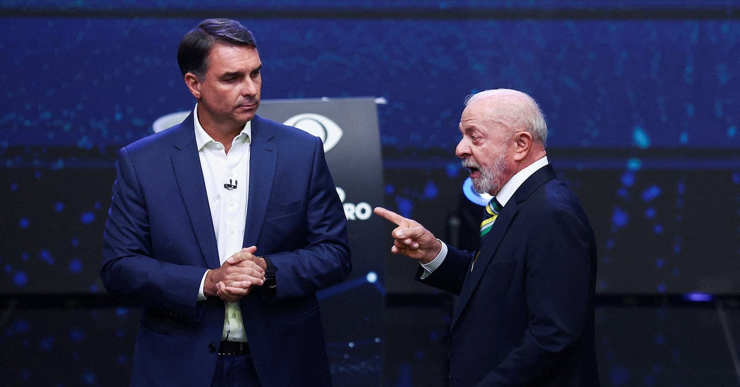 Brazil's Bolsonaro, Lula spar in first debate as personal attacks fly |  Reuters