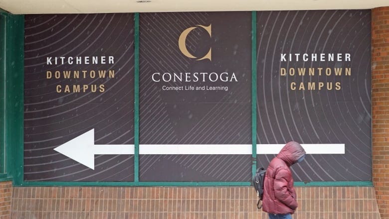 A man is walking away from Conestoga College campus on January 23, 2024. A man is walking away from Conestoga College campus on January 23, 2024.
