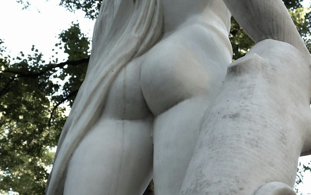 Marble statue of a man carrying a scroll