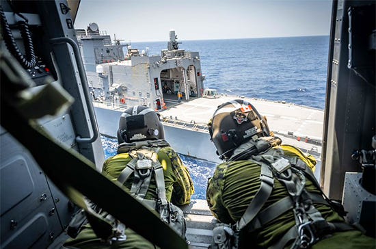 A CH-148 Cyclone Helicopter from HMCS CHARLOTTETOWN and a H-60 Sea Hawk Helicopter from JS IKAZUCHI conduct cross deck training during Exercise BALIKATAN 41-26 on 27 April 2026.