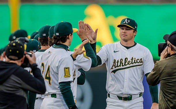 Mason MIller high fives teammates before the Athletics played the Chicago Cubs at Sutter Health Park for the A's home opener in Sacramento, Calif.,... Mason MIller high fives teammates before the Athletics played the Chicago Cubs at Sutter Health Park for the A's home opener in Sacramento, Calif.,...