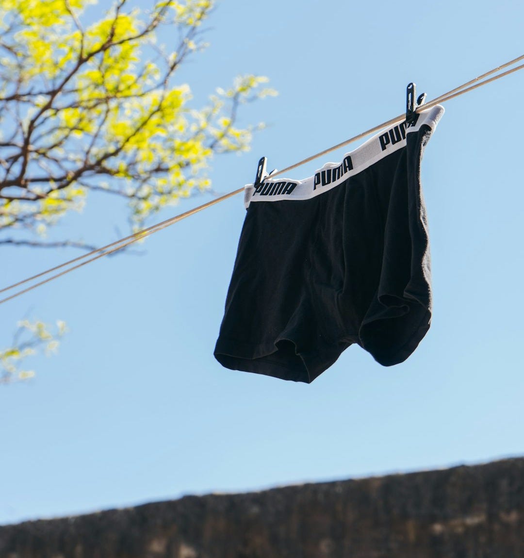 black and white shorts hanging on clothes line black and white shorts hanging on clothes line