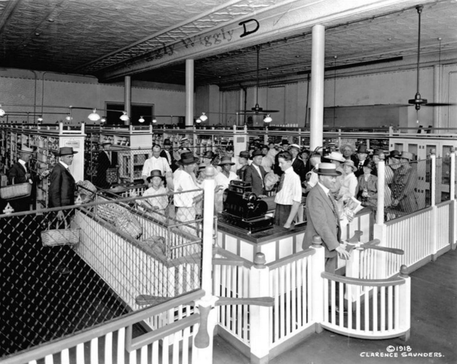 The first "modern" grocery store: the original Piggly Wiggly Store (1918, Memphis, Tennessee) was designed by grocer Clarence Saunders as a "Self-Serving Store" (patented), not only redesigning local grocery shopping but influencing The first "modern" grocery store: the original Piggly Wiggly Store (1918, Memphis, Tennessee) was designed by grocer Clarence Saunders as a "Self-Serving Store" (patented), not only redesigning local grocery shopping but influencing