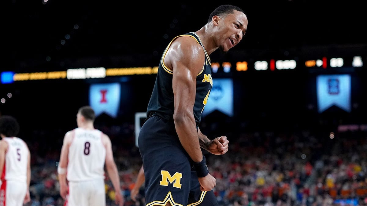 Michigan guard Nimari Burnett celebrates a basket during a basketball game against Arizona. Michigan guard Nimari Burnett celebrates a basket during a basketball game against Arizona.