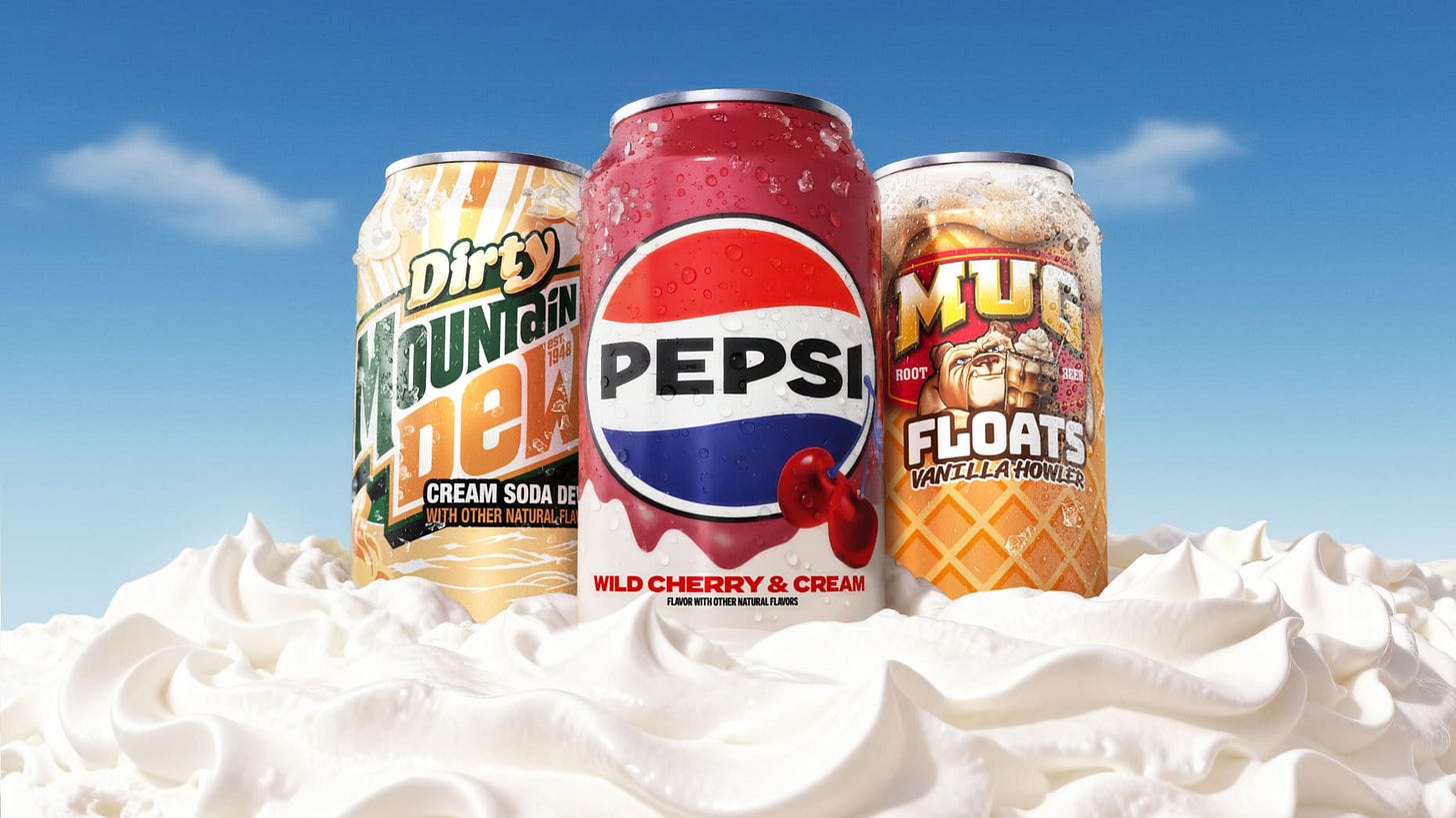 A can of Pepsi Wild Cherry & Cream, a can of Dirty Mountain Dew and a can of Mug Floats Vanilla Howler on a backdrop of whipped cream. A can of Pepsi Wild Cherry & Cream, a can of Dirty Mountain Dew and a can of Mug Floats Vanilla Howler on a backdrop of whipped cream.