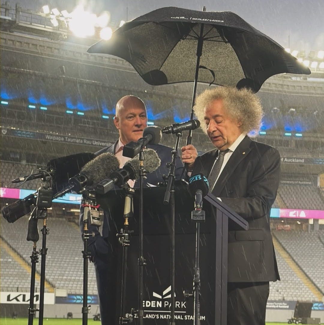 Luxon holds an umbrella. Luxon holds an umbrella.