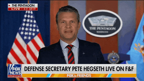 a man in a suit and tie stands in front of a fox news screen a man in a suit and tie stands in front of a fox news screen
