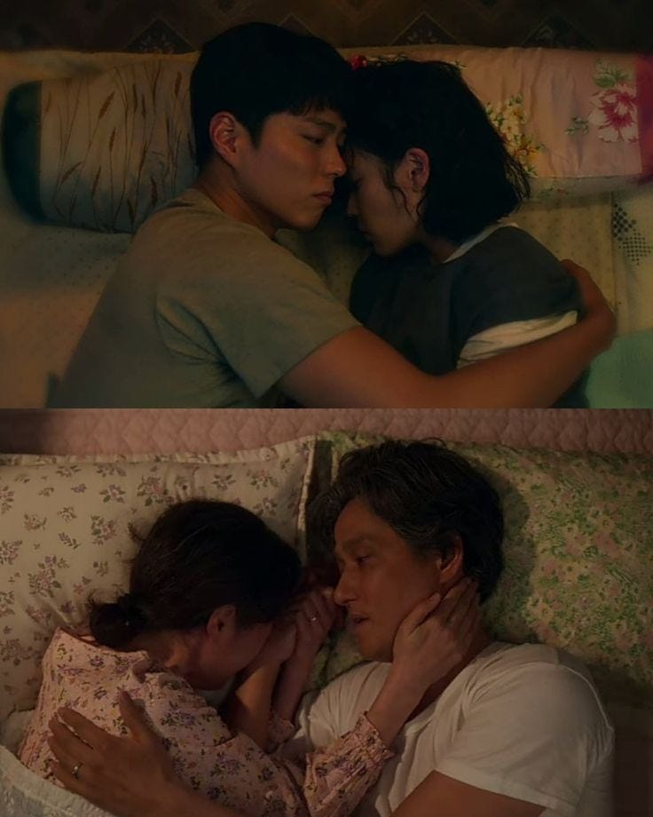 This may contain: two people laying in bed next to each other and one is kissing the other way