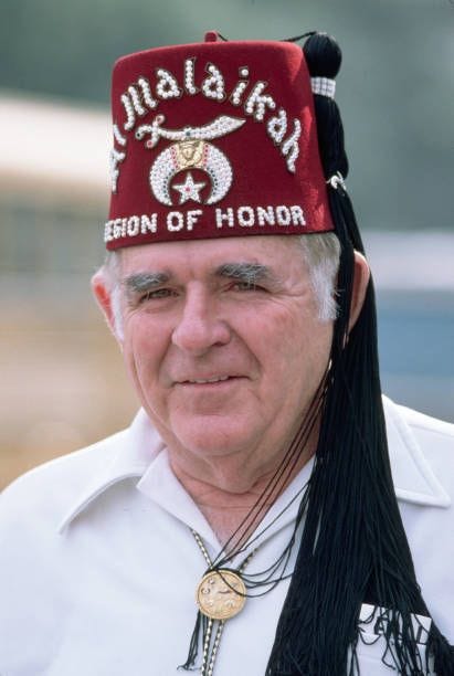 Shriner Wearing a Maroon Fez