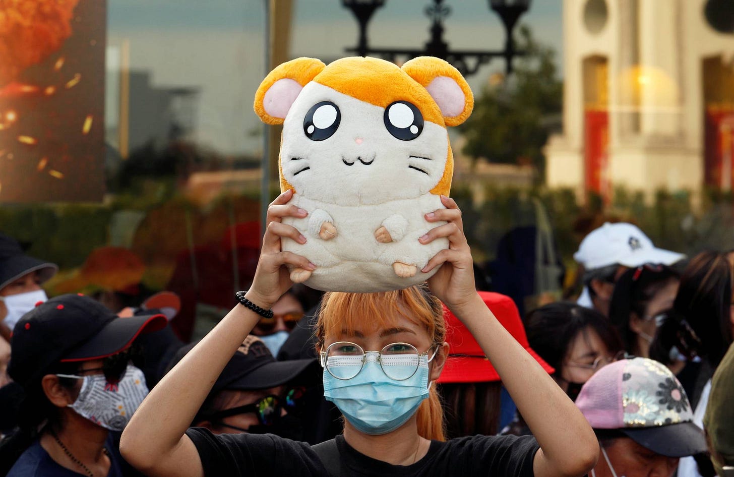 A demonstrator holds a stuffed Hamtaro toy during a protest demanding the resignation of Thai Prime Minister Prayuth Chan-o-cha in Bangkok last month. | REUTERS A demonstrator holds a stuffed Hamtaro toy during a protest demanding the resignation of Thai Prime Minister Prayuth Chan-o-cha in Bangkok last month. | REUTERS