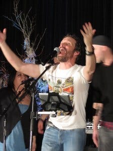 The entire ballroom is singing...