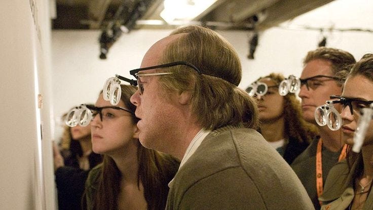 This may contain: a group of people with glasses on their faces looking at something in the distance while standing next to each other