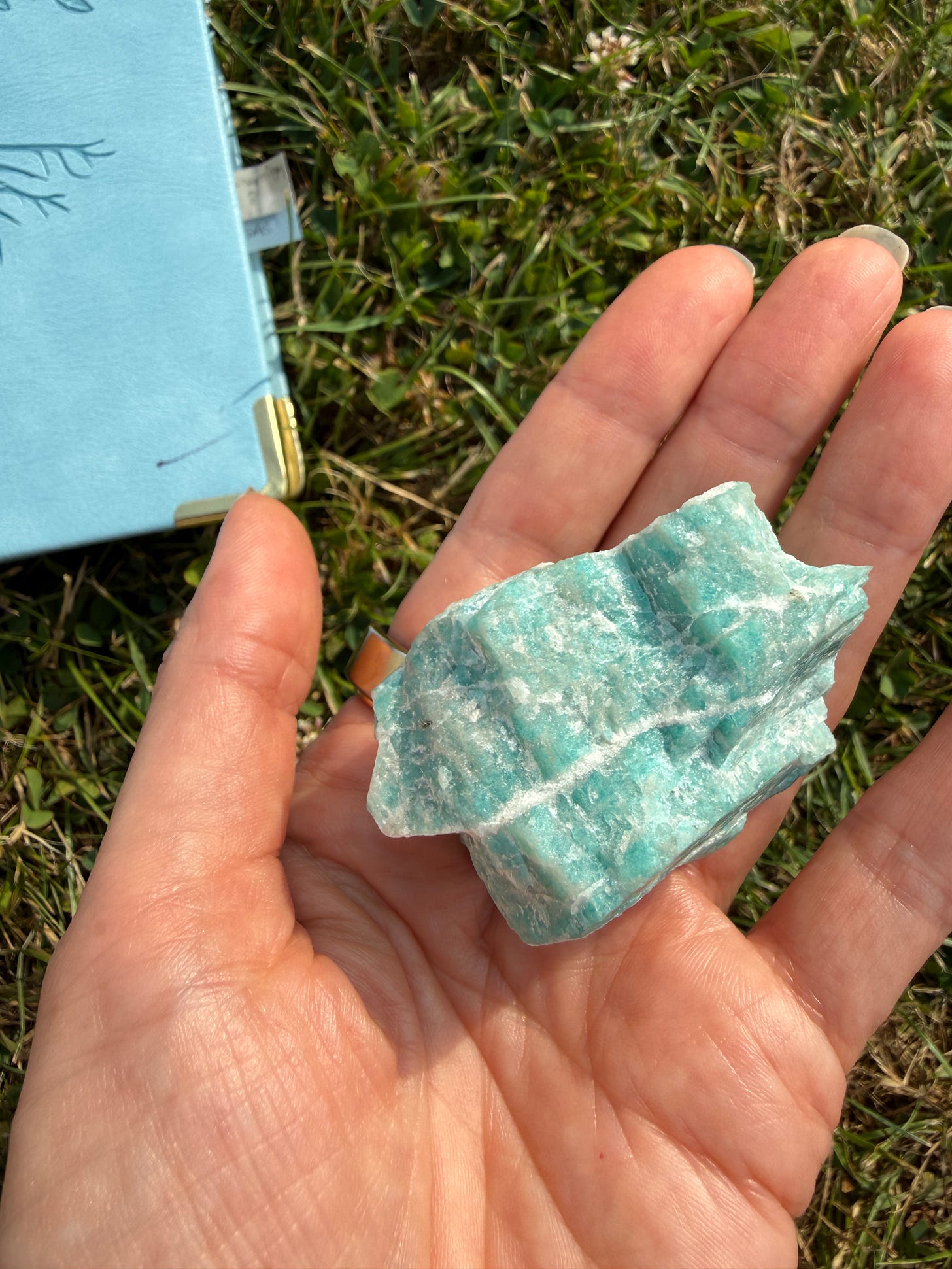Iolite crystal being held in my hand 