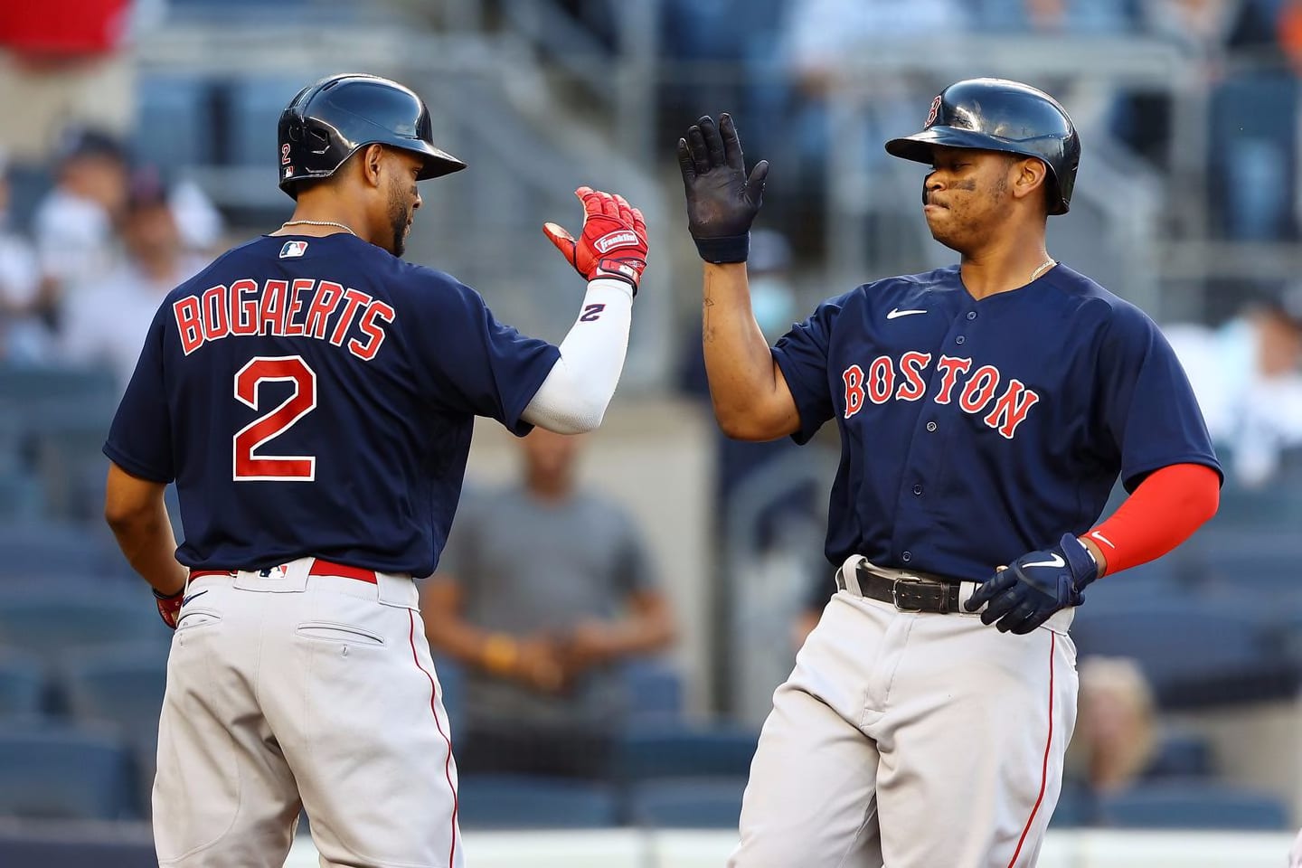 Rafael Devers is greeted at home plate by Xander Bogaerts following his three-run home run in the first inning Friday night.