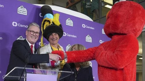 UK Election 2024: Keir Starmer gave a victory speech next to Elmo and a man  wearing a giant hat. This is why