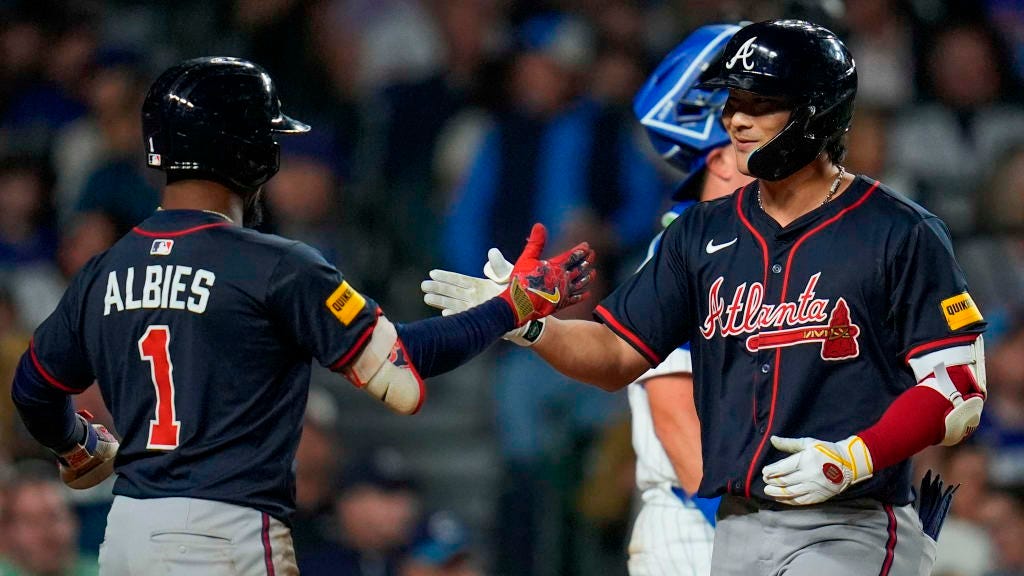 Ha-Seong Kim celebrates with Ozzie Albies
